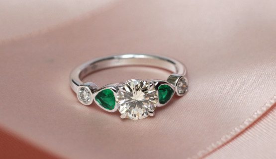 Engagement ring in white gold with diamonds and emeralds. It was made by the jewellery designer Annette Girardon in Paris.